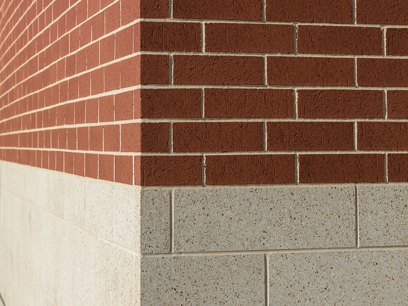 Amerimix colored cement mortar work with brick overlay and high polished block detail of the McLane Baylor Stadium building