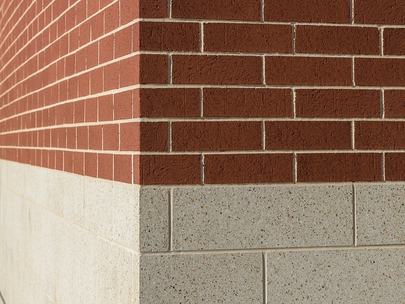 Amerimix colored cement mortar work with brick overlay and high polished block detail of the McLane Baylor Stadium building